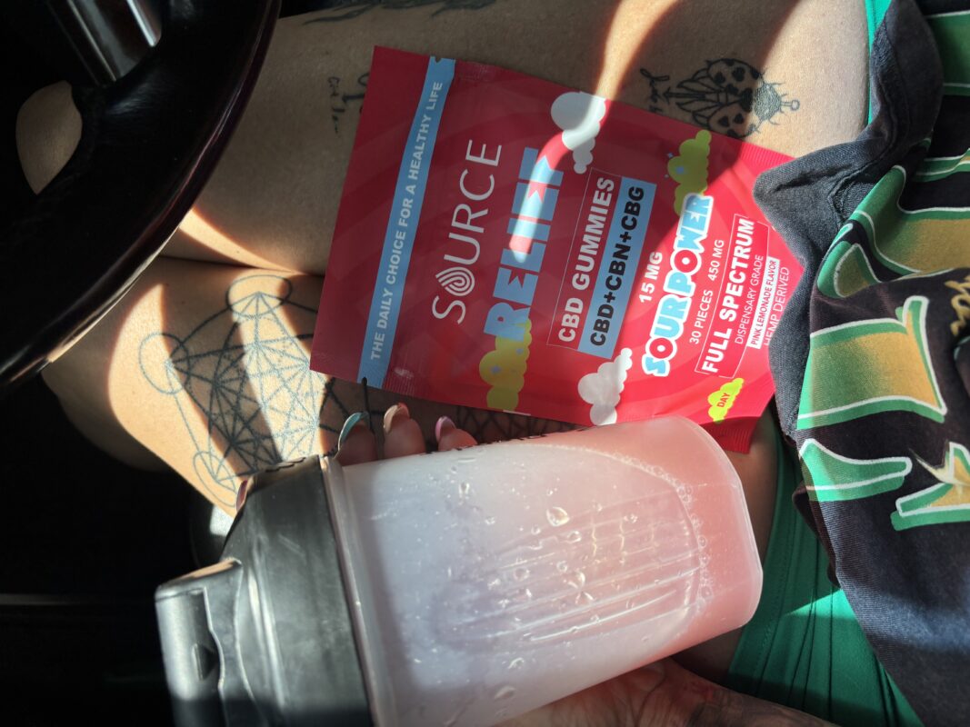 CBD gummies next to a pre-workout shaker bottle representing daily body regulation and wellness support