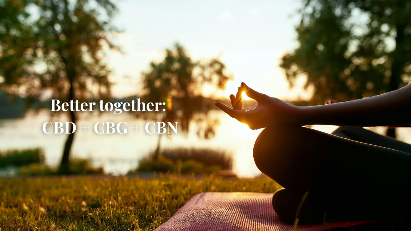 Woman seated in meditation pose with visible hand and leg, set against a natural outdoor water background, representing calm and balance in a wellness setting.